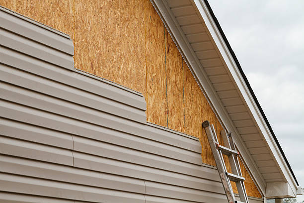 Professional Emergency Siding Repair technician working in Milton, MA